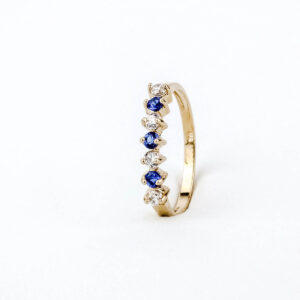 Anillo cintillo de tubo oro 18k con circones y zafiro azul