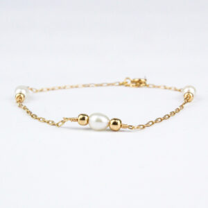 Pulsera perlas y bolitas oro 18k