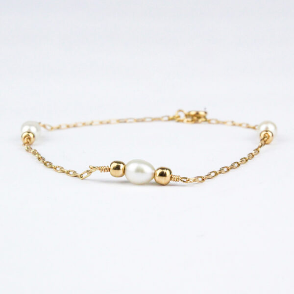 Pulsera perlas y bolitas oro 18k